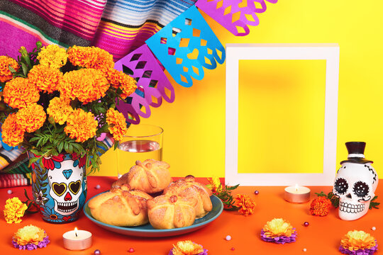 Day of the dead, Dia De Los Muertos Celebration Background With sugar Skull, calaverita, marigolds or cempasuchil flowers, bread of death or Pan de Muerto and empty frame. Traditional Mexican culture 
