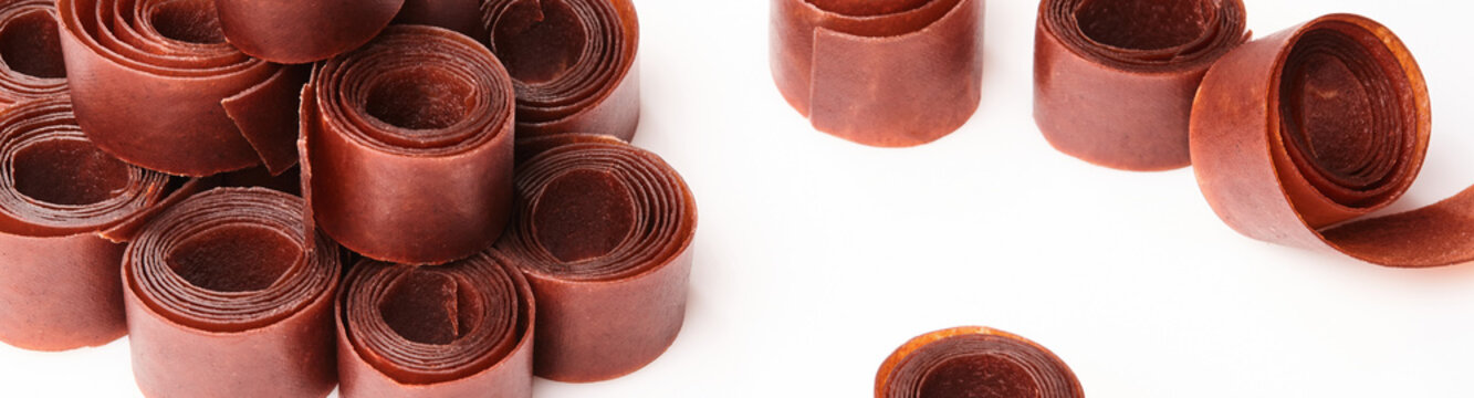 Traditional Georgian tklapi rolls on white background