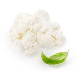 Fresh ricotta cheese isolated. Heap of ricotta soft cheese with basil leaves on white background. Cheese for package design.