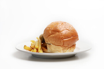 Homemade chicken burger with cheese and french fries on a plate isolated on white background