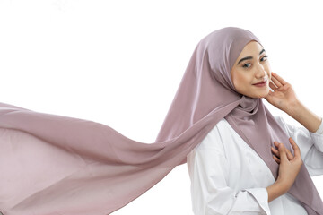 asian hijab woman wearing purple veil waving in the wind on white background