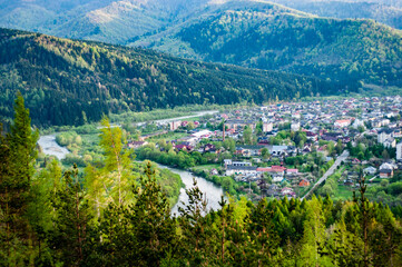 Skole town among Carpathian mountains, Ukraine, view from mountain, autumn season, nature outdoors.