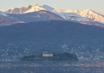 Fototapeta na wymiar Close up of Isola Madre (Mother Island) with the snow-capped mountain peaks in the background.Lake maggiore, Italian lakes, Piedmont, Italy.