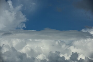 white clouds with bright sky