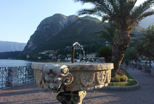 scenic fountain bowl vase on the background of the Italian idyllic lake  coast Como