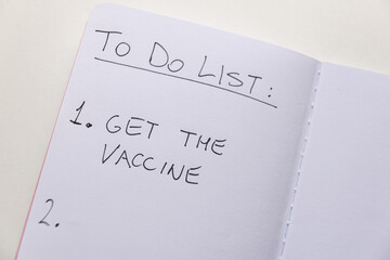 Blank diary page, with text "To do list" and "get the vaccine". Administration of vaccines; need to be vaccinated voluntarily. Green pass. 