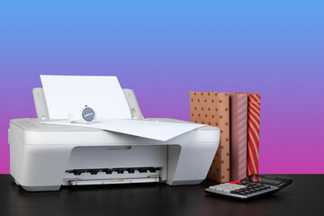 Home laser printer on desk against purple background
