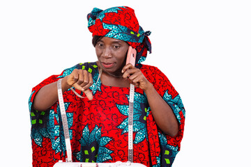 portrait of a seamstress having a conversation on the cell phone