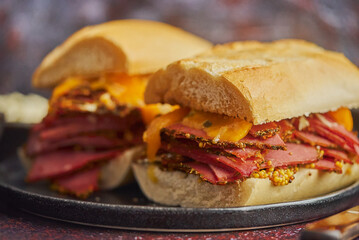 Super deluxe tasty grilled reuben sandwiches with pastrami meat, cheddar cheese