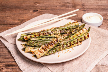 Ripe grilled asparagus. Wooden cutlery, healthy food concept