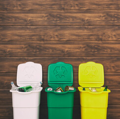 Three full dustbins for sorting trash on the backyard