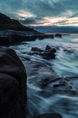 Wavey lines of water on the rocks