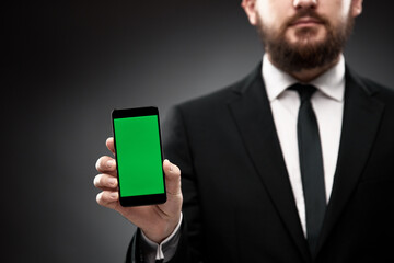 Businessman demonstrating smart phone screen