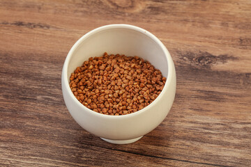 Raw buсkwheat cereal in the bowl