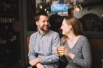 Smiling couple enjoying date in cafe