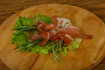 Sliced pork Jamon with rosemary