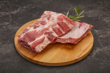 Raw pork ribs served rosemary
