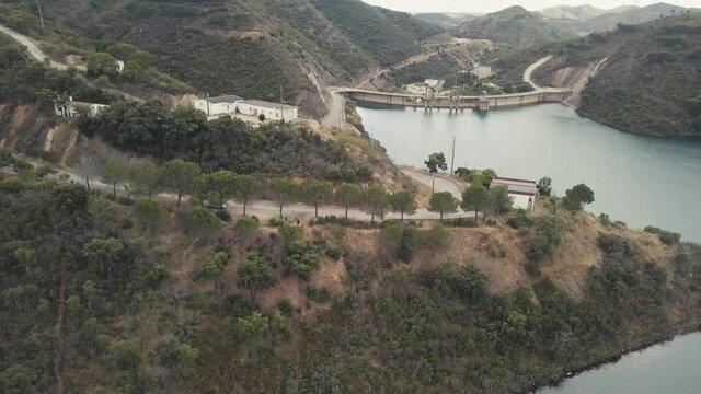 Aerial view showing beautiful green hilly landscape of Portugal and tranquil lake in Funcho de Diante.