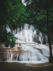 Obraz premium Scenic waterfall in lush rainforest. Sai Yok Noi Waterfall, Kanchanaburi, Thailand