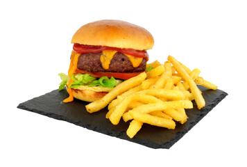 Cheeseburger and French fries in a brioche bread roll on a slate serving board