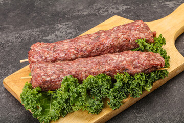 Raw minced beef kebab skewer