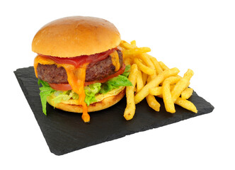 Cheeseburger and French fries in a brioche bread roll on a slate serving board