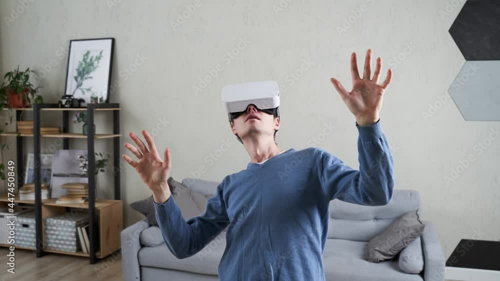 Wall mural man is using virtual reality headset.