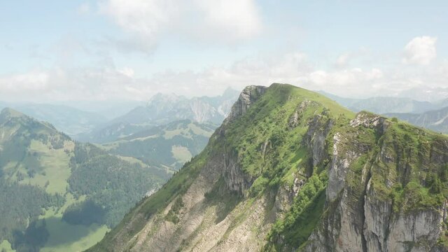 Beautiful aerial of green mountain summit in Switzerland
