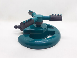 Water Irrigation Spinning Sprinkler to irrigate agricultural crops, lawns, landscapes, golf courses, and other areas in White Isolated Background