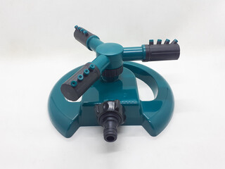 Water Irrigation Spinning Sprinkler to irrigate agricultural crops, lawns, landscapes, golf courses, and other areas in White Isolated Background