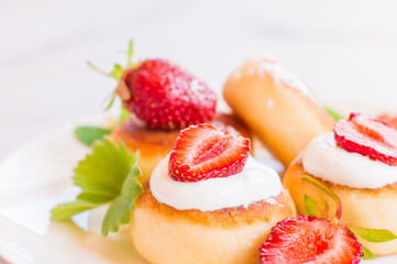 Cottage cheese pancakes, syrniki, curd fritters with strawberry. Gourmet Breakfast. White background
