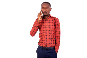 young serious businessman talking on mobile phone.