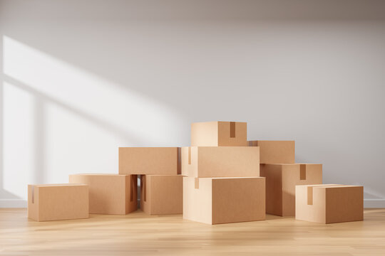 Simple minimal interior with white wall and wooden floor full of cardboard boxes. New house moving service.