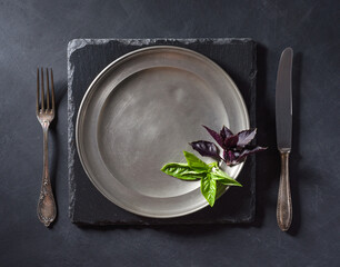 Basil leaves on an old plate.