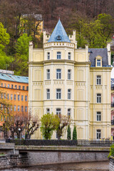 Fototapeta na wymiar Beautiful historic buildings on the embankment of the Tepla river in Karlovy Vary