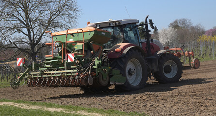 11.30 Tuesday 30 March 2021. Hintergasse, Saulheim, Rhineland-Palatinate, Germany. Tractor...