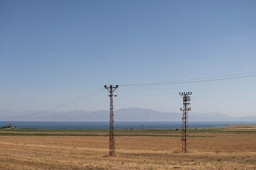 Lake Van, Turkey. and the surrounding wheat fields. Landscape photo in yellow and blue colors.