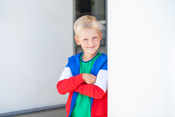 Blonde little boy in a summer park