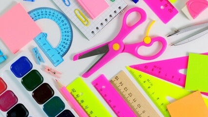 Colorful School Stationery. Back to school Education concept. School pupil Stationery. office supplies on white background. colored pencils, pen, pains, paper for student education. Top view, Flat Lay