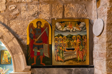 The holy  christian icons in the interior of the St. Jacobs orthodox  cathedral Jerusalem in Christian quarters in the old city of Jerusalem, Israel