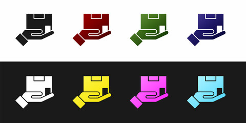 Set Delivery insurance icon isolated on black and white background. Insured cardboard boxes beyond the shield. Vector.