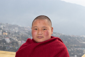 teen buddhist monk portraits close up with details at day from flat angle
