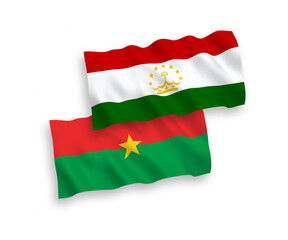 National vector fabric wave flags of Burkina Faso and Tajikistan isolated on white background. 1 to 2 proportion.