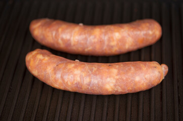 Home sausage fried on home electric grill