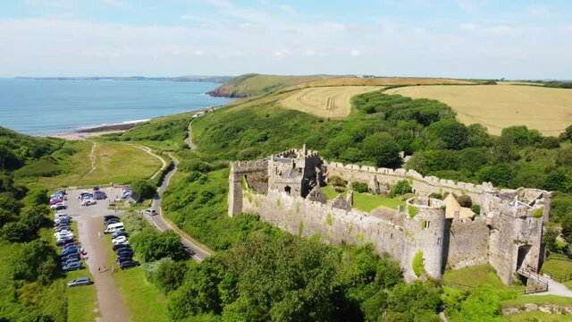Drone view of Manorbier castle in West Wales, a Norman castle founded in the 11th century.