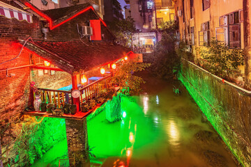 Exterior of the old buildings by the creek at evening time. Yangshuo. Guangxi Province.