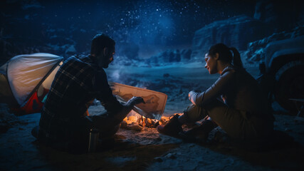 Happy Couple Camping in the Canyon Wilderness at Night Together, Sitting by Campfire, Plan Hiking...
