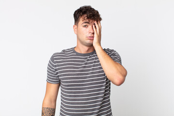 young handsome man feeling bored, frustrated and sleepy after a tiresome, dull and tedious task,...