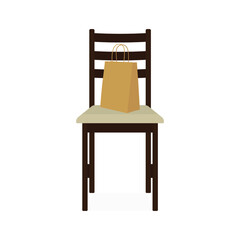 Paper bag stands on a chair on a white background