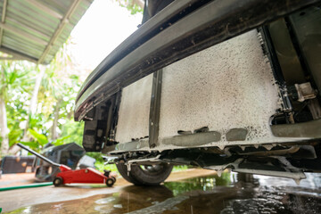 washing and cleaning the car radiator cooling panel, mold stains on the very dirty car air-conditioning coil..